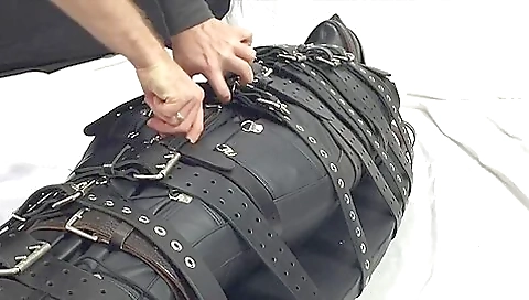 Restrained With 20 Belts In Heavy Leather Restrained With 20 Belts In Heavy Leather